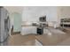 Efficient kitchen with tile floors, stainless steel appliances, and ample counter space at 4826 Sable Ridge Ct, Leesburg, FL 34748