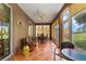Screened lanai with tile floors, ceiling fan, and comfortable seating area at 4826 Sable Ridge Ct, Leesburg, FL 34748