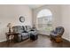 Cozy living area with a large window and comfortable seating at 4826 Sable Ridge Ct, Leesburg, FL 34748
