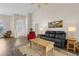 Inviting living room featuring a vaulted ceiling and modern flooring at 4826 Sable Ridge Ct, Leesburg, FL 34748