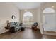 Comfortable living room with arched window, recessed lighting, and modern flooring at 4826 Sable Ridge Ct, Leesburg, FL 34748