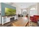 Spacious living room with modern flooring, arched windows, and ample natural light at 4826 Sable Ridge Ct, Leesburg, FL 34748