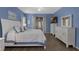 Spacious main bedroom with ensuite bathroom and ample natural light at 4826 Sable Ridge Ct, Leesburg, FL 34748