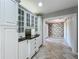 Dining area featuring custom cabinets, elegant lighting, and tile flooring at 504 Banning Beach Rd, Tavares, FL 32778