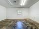 Garage features bare walls and a single window at 504 Banning Beach Rd, Tavares, FL 32778
