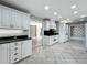 Open kitchen with granite countertops, stainless steel appliances, and tile flooring at 504 Banning Beach Rd, Tavares, FL 32778