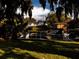 Waterfront lot with boat, boathouse, and grassy lawn at 504 Banning Beach Rd, Tavares, FL 32778