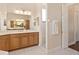 Bright bathroom with dual sinks, shower and white countertops at 5418 Sandy Hill Ln, Lady Lake, FL 32159