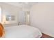 Bedroom with a hardwood floor, open closet and a window at 5418 Sandy Hill Ln, Lady Lake, FL 32159