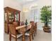 Formal dining room with chandelier and china cabinet at 5418 Sandy Hill Ln, Lady Lake, FL 32159