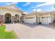 Close-up of a three-car garage and decorative stone, leading to the front door at 5418 Sandy Hill Ln, Lady Lake, FL 32159