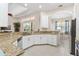 Modern kitchen with granite counters, stainless appliances, and an open view to the living area at 5418 Sandy Hill Ln, Lady Lake, FL 32159