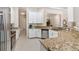 Well-appointed kitchen with granite countertops, stainless steel appliances, and ample counter space at 5418 Sandy Hill Ln, Lady Lake, FL 32159