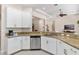 Kitchen featuring white cabinets, stainless appliances, and granite counters at 5418 Sandy Hill Ln, Lady Lake, FL 32159