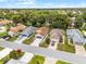 A picturesque residential area showcasing meticulously kept homes, lush trees, and peaceful, orderly streets at 5507 Laver St, Leesburg, FL 34748