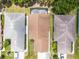 Aerial view highlighting the home's roof and proximity to neighboring houses at 5507 Laver St, Leesburg, FL 34748