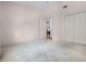 Bright bedroom with a neutral palette, carpet, a ceiling fan and large closet at 5507 Laver St, Leesburg, FL 34748