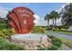 The 'Highland Lakes' community entrance sign is surrounded by lush landscaping at 5507 Laver St, Leesburg, FL 34748