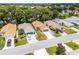 Well-kept single-story homes in a quiet neighborhood with mature landscaping and inviting driveways at 5507 Laver St, Leesburg, FL 34748