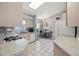 Bright kitchen boasts a dining nook, white appliances, and stylish countertops at 5507 Laver St, Leesburg, FL 34748