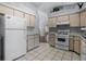 Bright kitchen with stainless steel appliances, tiled floor, and ample counter space at 5507 Laver St, Leesburg, FL 34748