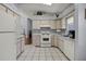 Bright kitchen with stainless steel appliances, tiled floor, and ample counter space at 5507 Laver St, Leesburg, FL 34748