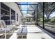 Enclosed patio providing ample seating, an umbrella, and an outdoor garden at 5507 Laver St, Leesburg, FL 34748