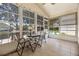 Screened lanai featuring tile floors and multiple windows at 5507 Laver St, Leesburg, FL 34748
