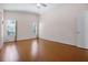 Spacious main bedroom featuring wood floors, vaulted ceilings, and plenty of natural light at 5507 Laver St, Leesburg, FL 34748