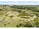 Wide aerial perspective showing this land parcel's proximity to waterways, marshland, and convenient road access at 5729 Bible Camp Rd, Groveland, FL 34736
