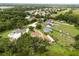Neighborhood aerial view highlighting this community's wooded landscape, featuring the neighboring homes and local foliage at 5729 Bible Camp Rd, Groveland, FL 34736