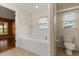 Bright bathroom features large soaking tub at 5729 Bible Camp Rd, Groveland, FL 34736