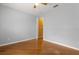 Minimalist bedroom showcasing sleek wood floors and a ceiling fan for added comfort at 5729 Bible Camp Rd, Groveland, FL 34736