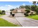 View of single-story home and a detached garage, highlighting the spacious property and ample parking at 5729 Bible Camp Rd, Groveland, FL 34736