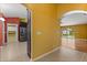 Hallway leading to the kitchen and living area, showcases the seamless transition and open concept at 5729 Bible Camp Rd, Groveland, FL 34736