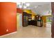 Open kitchen with stainless appliances, granite counters, and tile flooring at 5729 Bible Camp Rd, Groveland, FL 34736