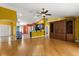 Open living space flows into the kitchen, enhanced by hardwood floors and cohesive design at 5729 Bible Camp Rd, Groveland, FL 34736