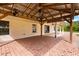 Inviting brick patio under a wooden pergola, perfect for outdoor living and relaxing in style at 5729 Bible Camp Rd, Groveland, FL 34736
