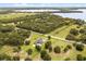 Aerial view showcasing the home's spacious lot, modern design, and proximity to scenic landscapes and lakes at 6031 Dora Dr, Mount Dora, FL 32757