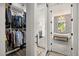 Elegant bathroom featuring a soaking tub, patterned tile, and custom closet, creating a spa-like retreat at 6031 Dora Dr, Mount Dora, FL 32757