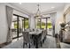 Dining room featuring a modern chandelier and sliding glass doors to the outdoor patio at 6031 Dora Dr, Mount Dora, FL 32757