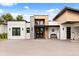 Front entrance view showcasing a walkway, black frame windows, and modern design at 6031 Dora Dr, Mount Dora, FL 32757