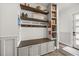 Hallway with custom built-ins: shelves, drawers, bench and cubbies providing ample storage at 6031 Dora Dr, Mount Dora, FL 32757