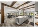 Open-concept kitchen with an island and stainless steel appliances seamlessly connects to the living and dining areas at 6031 Dora Dr, Mount Dora, FL 32757
