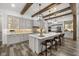 Beautiful kitchen featuring a large island, pendant lights, stainless steel appliances, and custom cabinetry at 6031 Dora Dr, Mount Dora, FL 32757