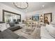 Bright living room featuring modern decor, stylish furniture, and a built-in shelving unit at 6031 Dora Dr, Mount Dora, FL 32757