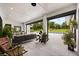 Inviting outdoor living space with cozy seating and retractable doors to pool, perfect for entertaining at 6031 Dora Dr, Mount Dora, FL 32757