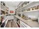 Well-organized pantry with ample shelving and counter space, perfect for storage and meal preparation at 6031 Dora Dr, Mount Dora, FL 32757