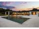 Backyard pool at dusk surrounded by patio, with a view of the home's architectural design at 6031 Dora Dr, Mount Dora, FL 32757