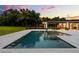 Inviting pool and spa area with an outdoor kitchen and dining area, perfect for entertaining at 6031 Dora Dr, Mount Dora, FL 32757